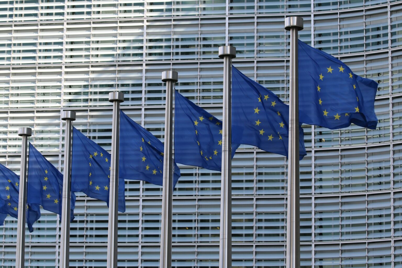 Flags of the European Union in front of the Berlaymont building in Brussels